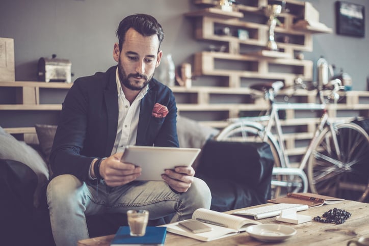 man using his iPad