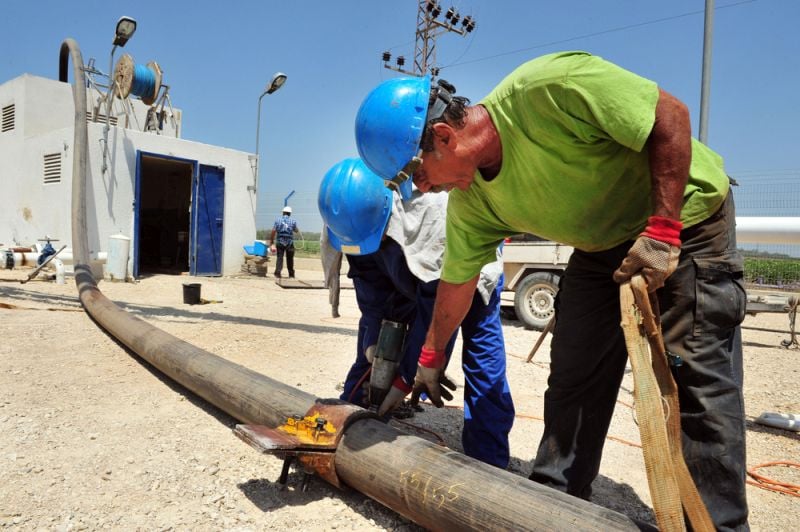 engineers maintaining water pipes