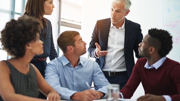 Man leading a group of employees