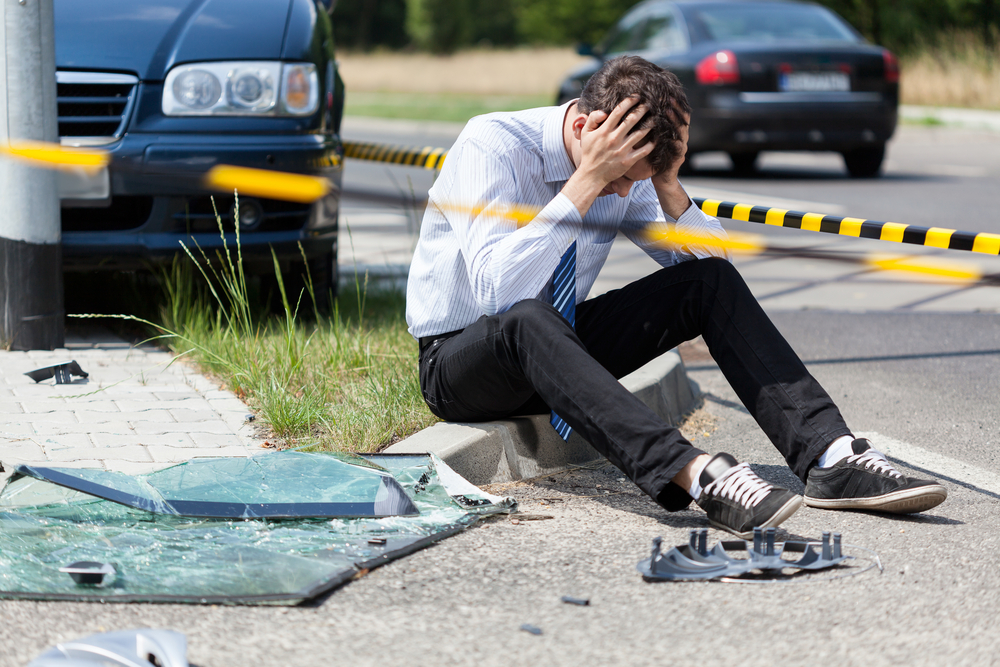 driver on the side of the road after an accident