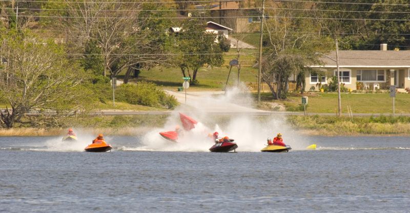 Boats crash surrounded by other watercraft