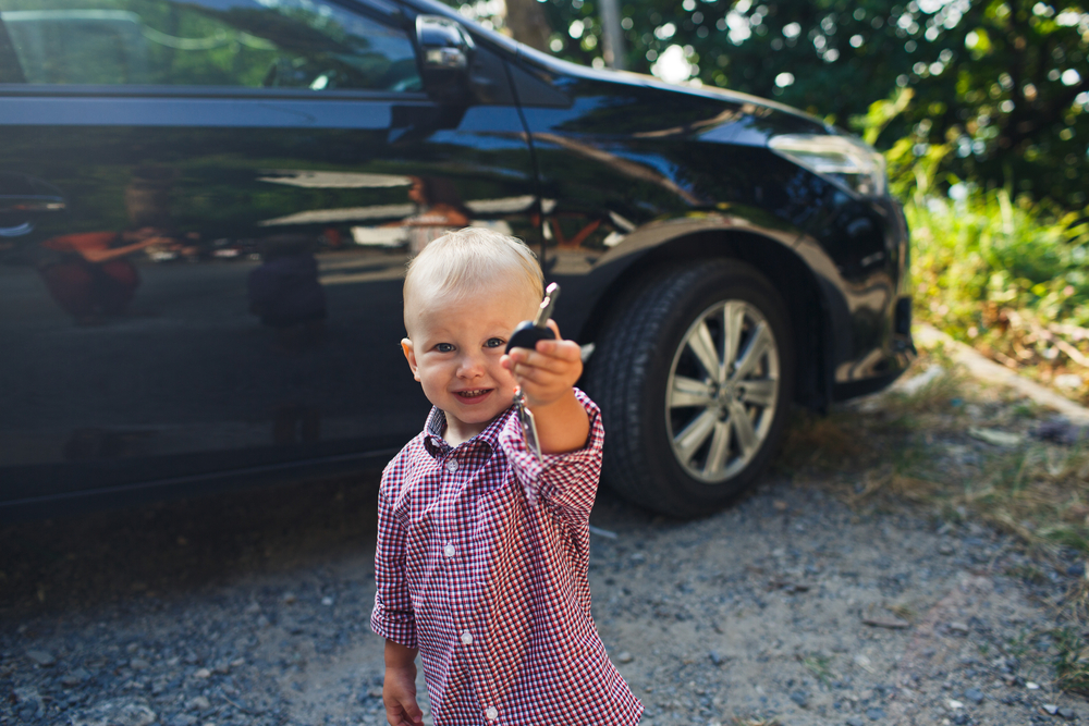 child holding car keys