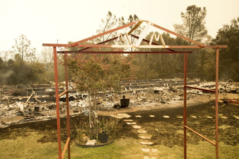 A trellis rests in front of a Hummingbird Lane residence leveled by the Detwiler fire