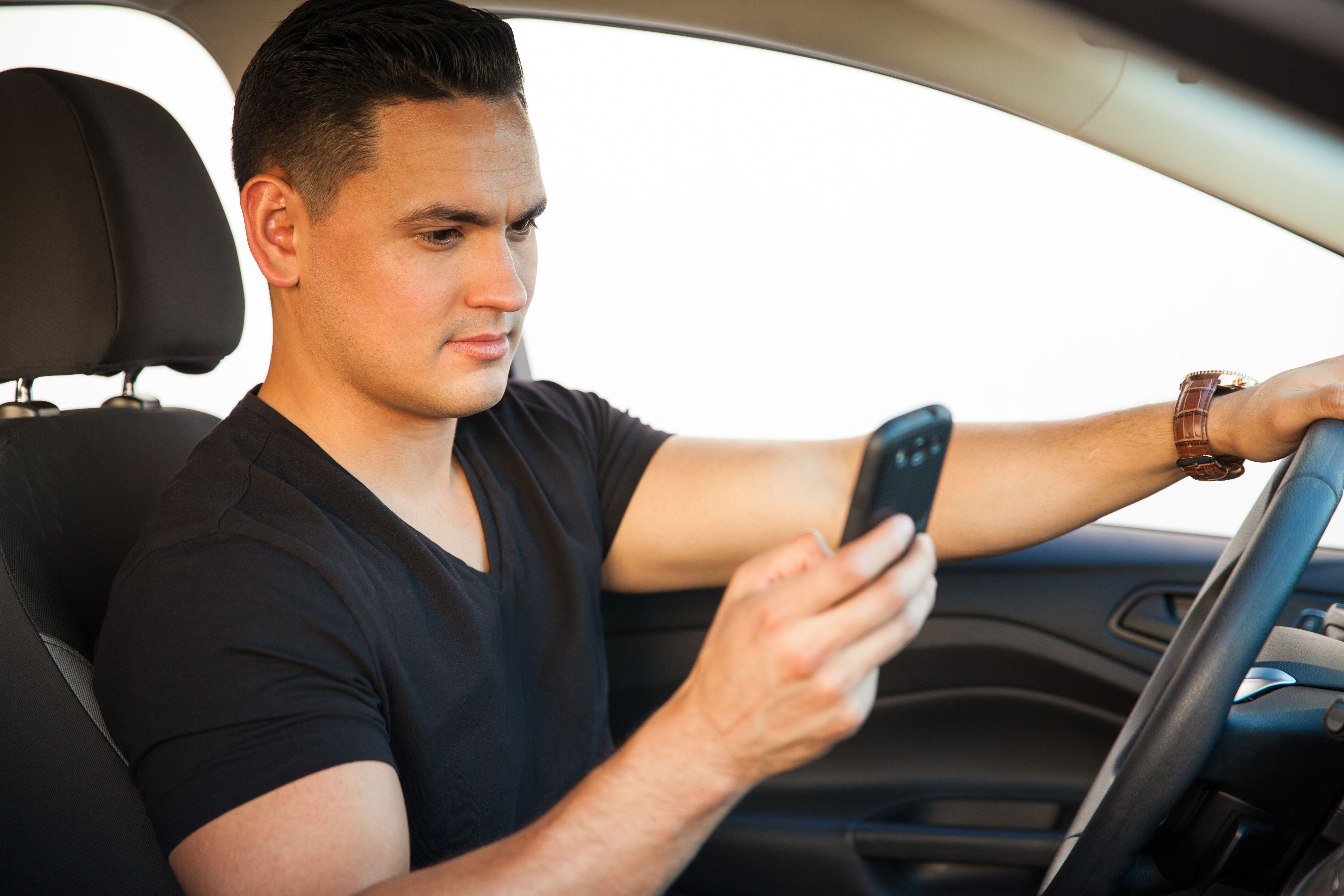 Man driving cell phone