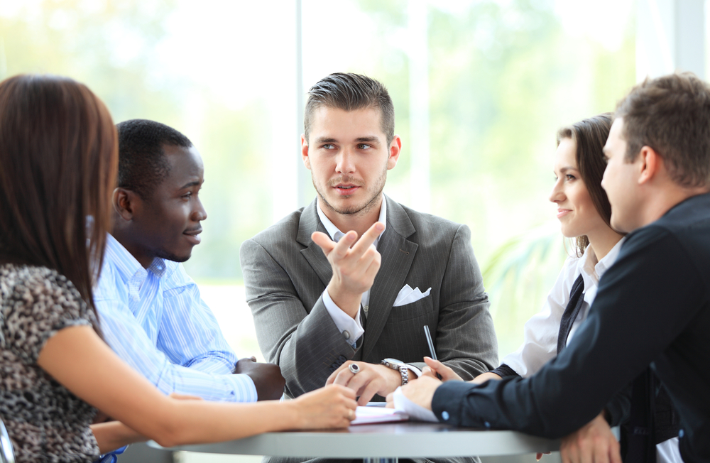 Group of young professionals having a discussion