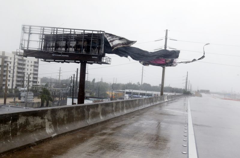 A billboard is ripped apart by high winds along Interstate 95 Northbound as Hurricane Irma passes