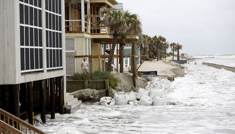 A man looks over the pounding surf caused by Hurricane Irma in the Wild Dunes Resort community of the Isle of Palms, S.C.