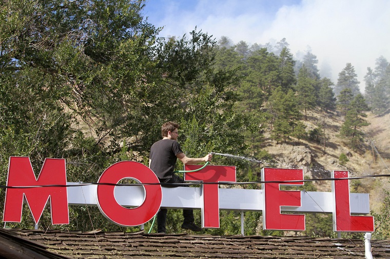 According to the U.S. Forest Products Laboratory, a wood shingle roof like this one photographed at at the Silver Saddle Motel in Boulder, Colo. in 2010, will last up to 30 years under favorable conditions. (AP Photo/Barry Gutierrez)