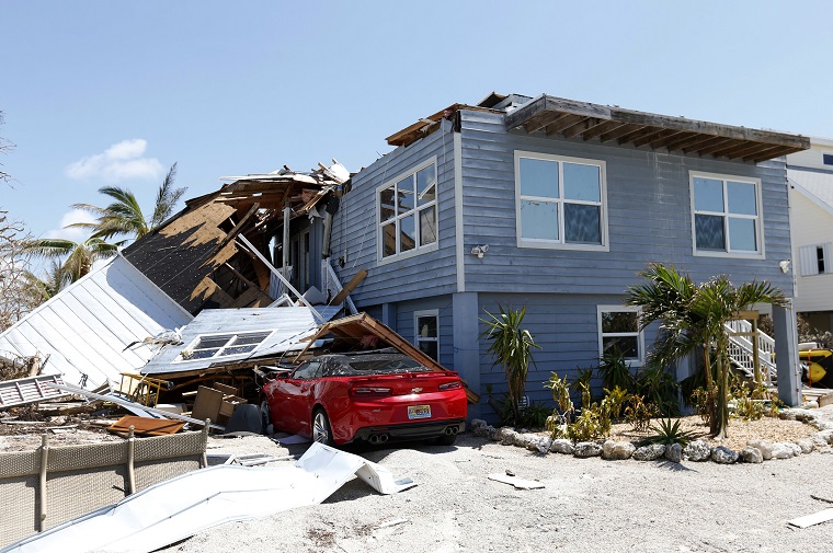 Hurricane Irma spurred many claims for roof shingles that were blown off, especially on corners. (AP Photo/Wilfredo Lee)