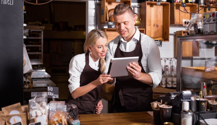 Millennial business owners using a tablet