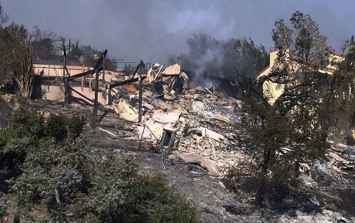 Bob Pazen's home is a smoldering ruin after after a wildfire swept through Ventura, Calif.