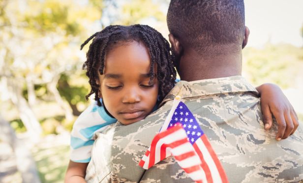 U.S. soldier holding his child