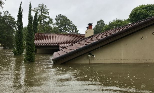 House submerged in flood water.