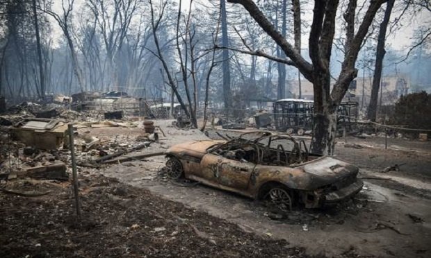 A burned-out vehicle stands during the Camp Fire in Paradise, California, U.S., on Tuesday, Nov. 13, 2018.