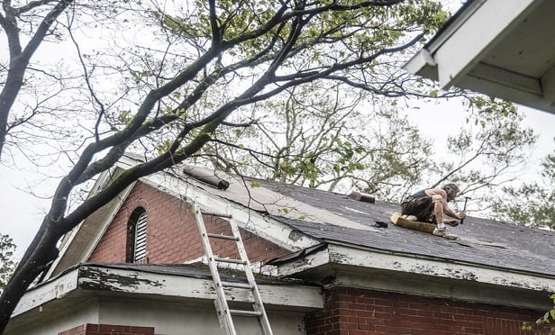In its decision, the district court found that the undisputed evidence showed that the wind-driven rain of Hurricane Irma had entered the property due to deterioration of the roof coverings and waterproofing sealants, deficient roof repairs, and a general lack of maintenance of the roof surface, as well as wear and tear, deterioration, and inadequate maintenance of window and door perimeter sealant and stucco finishes. (Photo: Alex Wroblewski/Bloomberg) 