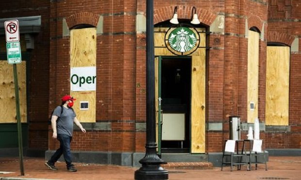 A Starbucks store, partially reopened during the Coronavirus pandemic, is boarded up to protect against vandalism during the days of demonstrations protesting the killing of George Floyd and police brutality, Washington, D.C. June 6, 2020. (Photo: Diego M. Radzinschi/ALM)