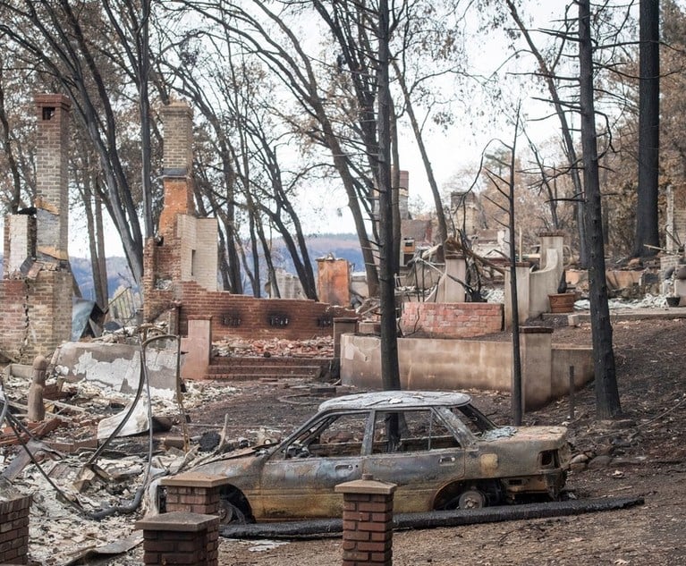 Burned-out homes and vehicles stand in Paradise, California, U.S., on Monday, November 26, 2018. Credit: David Paul Morris