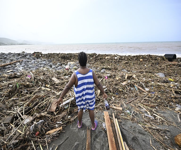 Beryl is the second named storm, first hurricane, and first major hurricane of the 2024 Atlantic hurricane season. Here, a woman looks at a beach littered with trash in the aftermath of Hurricane Beryl at Bull Bay, Jamaica. (Photo credit: Ricardo Makyn/AFP/Getty Images)