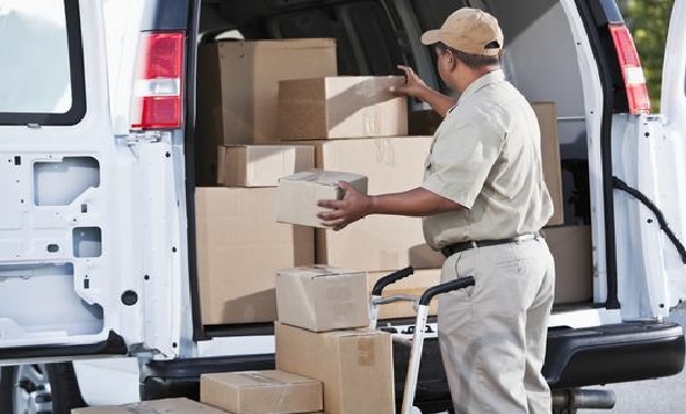 Delivery person taking boxes out of a van. Photo: Susan Chiang/iStockphoto.com
