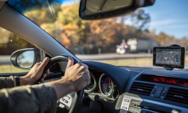 man driving a car