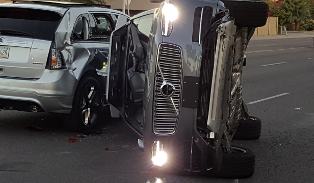 Here, an Uber Technologies Inc. self-driving Volvo sports utility vehicles (SUV) sits on the road after a high-impact crash in Tempe, Arizona, U.S., in March 2017. Uber's self-driving cars were back on public roads three days after this crash. (Photo: Mark Beach/Fresco News via Bloomberg)