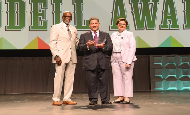 Launched in 1963, RIMS Annual Conference & Exhibition is a four-day event that attracts roughly 10,000 risk and insurance professionals. The organization's annual awards luncheon marked the first day of the event. Here, RIMS President Robert Cartwright, Jr. (Left) and RIMS CEO Mary Roth present the Harry & Dorothy Goodell to AON’s Ward Ching at RIMS 2018 in San Antonio.