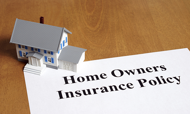 Homeowners insurance policy with small model house