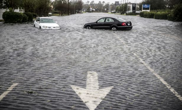 Vehihcles submerged in floodwaters