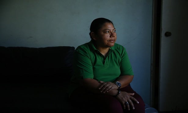 The status of undocumented visitors already in the U.S. must be clarified to remove the uncertainties that exist. The insurance industry can help policyholders understand and manage the risks in the current, confused system. Here, Iris Acosta, a 51-year-old hotel housekeeper from Honduras, pauses for photos in her sister's apartment in Los Angeles. Acosta is a Temporary Protected Status recipient, a program that is geared toward countries ravaged by natural disasters or war. (AP Photo)
