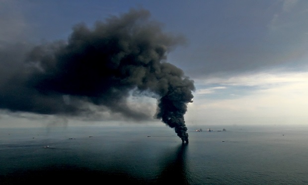 Smoke billows from controlled oil burns near the site of the BP Plc Deepwater Horizon oil spill in the Gulf of Mexico off the coast of Louisiana. The BP Plc oil spill began when the leased Transocean Deepwater Horizon oil rig exploded on April 20, 2010. (Photo Derick E. Hingle/Bloomberg)