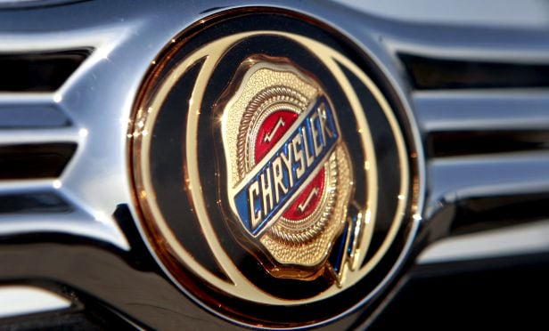 A Chrysler emblem on the front of a Golling Chrysler Jeep Dodge