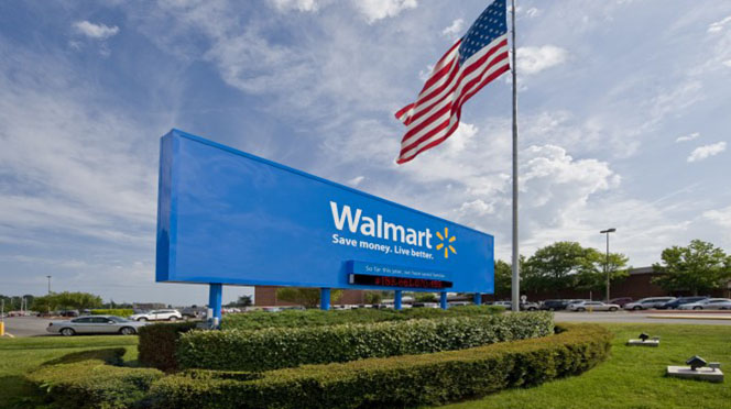Walmart corporate headquarters sign with American flag in front