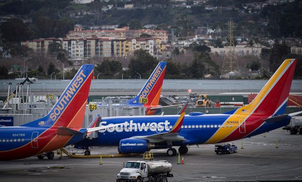 Southwest Airlines Co. planes stand on the tarmac at San Francisco International Airport