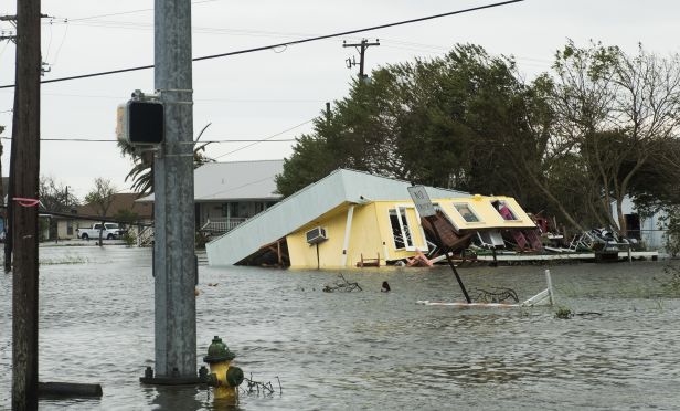 Flooded home collapsing