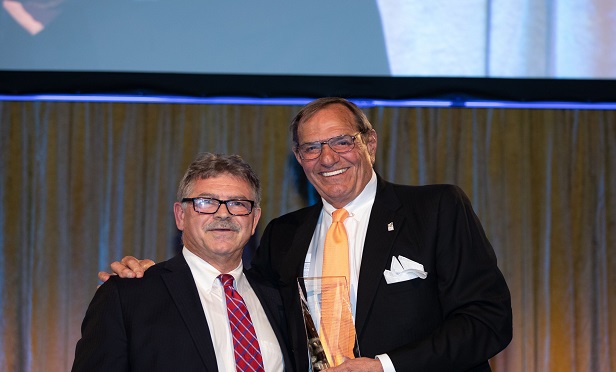 "There's always been a consciousness of giving back, understanding the needy," says Markel (right), recipient of the IICF's "Double I" award. "But what has changed is the industry has become much more financially sophisticated and solid." (Photo: IICF) 
