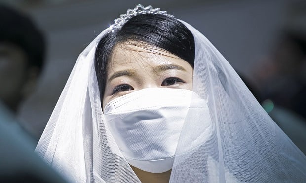 GAPYEONG-GUN, SOUTH KOREA - FEBRUARY 07: Thousands of couples attend a mass wedding held by the Family Federation for World Peace and Unification, aka Unification Church despite the spread of the 2019 Novel Coronavirus also known as Wuhan Coronavirus on February 7, 2020 in Gapyeong-gun, South Korea. Some 4,000 'Moonies', believers of Unification Church, which was named after the founder Moon Sun Myung, attend the mass wedding which began in the early 1960s. On this day China's National Health Commission raised the death toll from the virus from the virus to 636 from 563, global total is 638. (Photo by Woohae Cho/Getty Images)