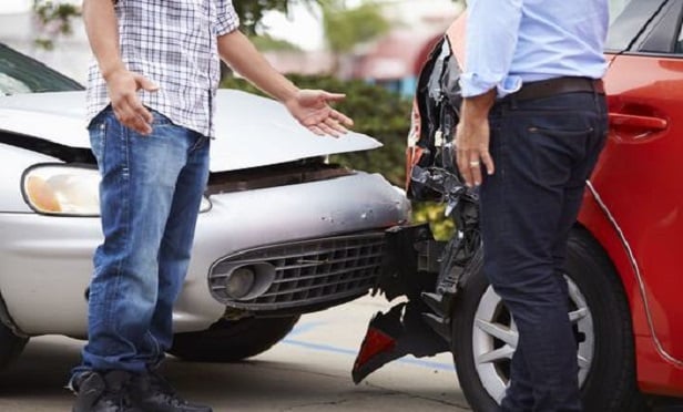 Two men discussing an auto accident.