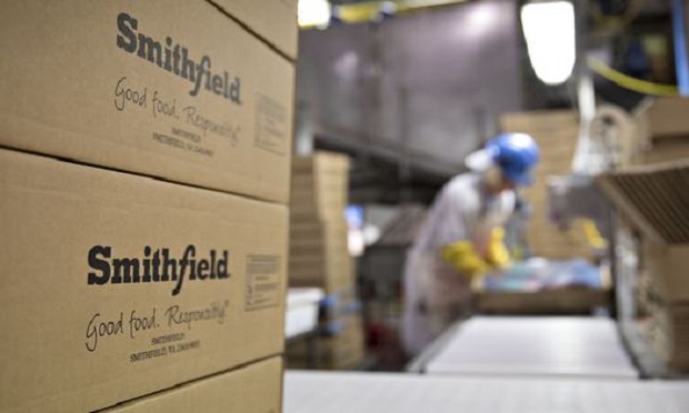 The Smithfield Foods Inc. logo is displayed on boxes at the company's pork processing facility in Milan, Missouri, U.S., on Wednesday, April 12, 2017. (Photo: Daniel Acker/Bloomberg)