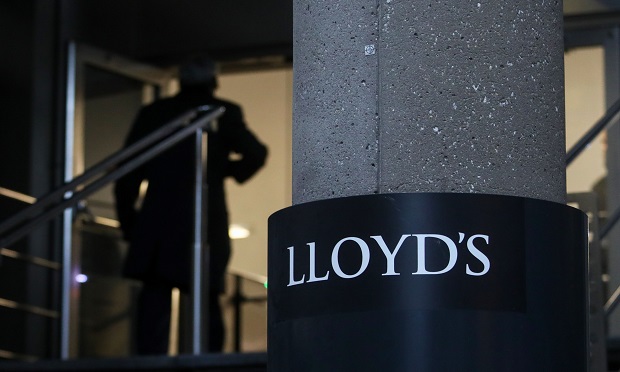 A visitor enters the Lloyd's of London Ltd. building in London, U.K. (Photo: Chris Ratcliffe/Bloomberg)