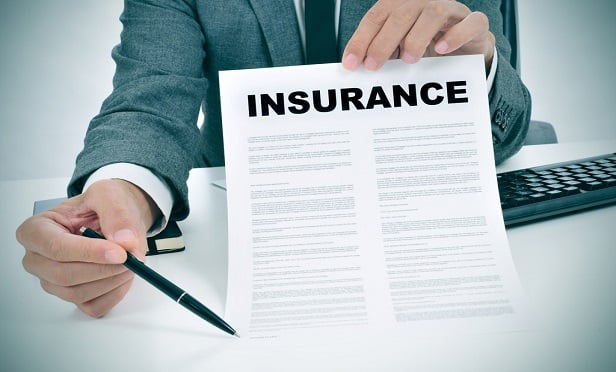Man holding an insurance policy.