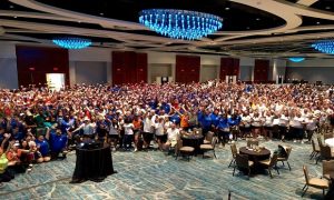 Attendees of 2019 WCI Educational Conference get revved up for the Give Kids World the event's annual Service Day. (Photo provided by WCI)