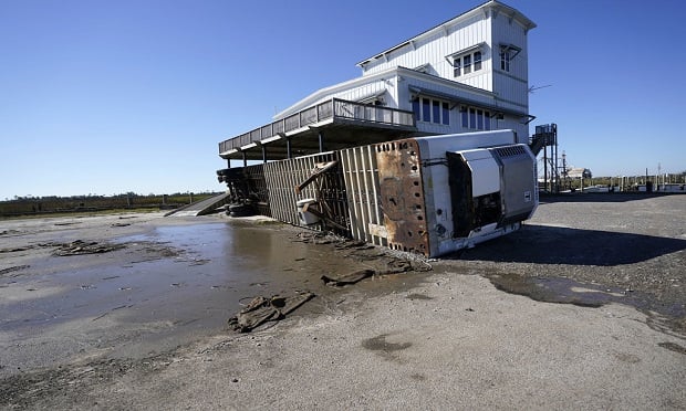 A tractor trailer is seen overturned at Bayouo Caddy Fisheries in Lakeshore, Miss., Thursday, Oct. 29, 2020, in the aftermath of Hurricane Zeta, which swept through the area Wednesday. Photo: Gerald Herbert/AP Photo