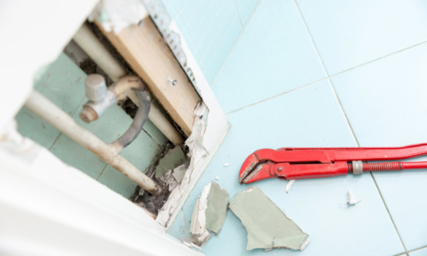 Around 12% of homeowners reported spotting an issue, but were too concerned about potential virus exposure to bring a contractor in to make repairs, according to the homeowner risk survey. <i>(Credit: urbans/Shutterstock.com)</i>