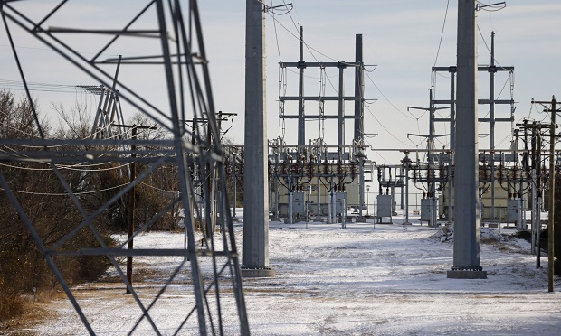 Transmission towers and power lines lead to a substation after a snow storm on February 16, 2021, in Fort Worth, Texas. (Photo: Bloomberg)