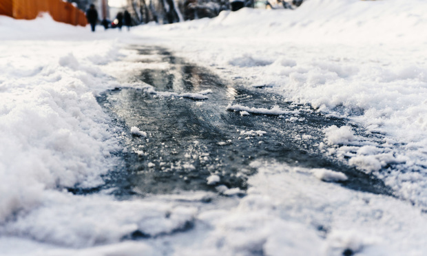 When a contractor has removed the snow and left the premises, but someone falls later, who is responsible for the injuries? (Photo: kolt_duo/Shutterstock)