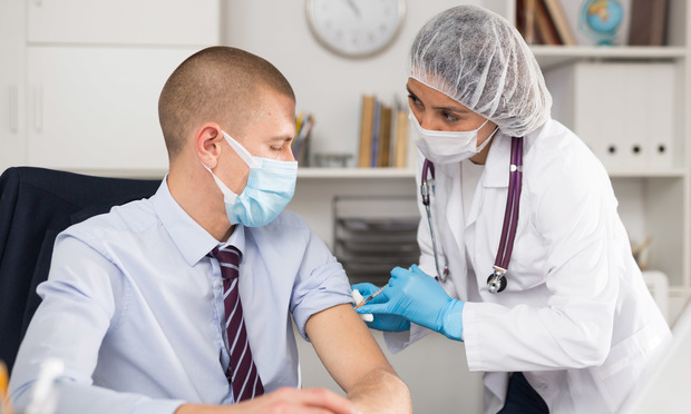 “Employers can try to plan ahead by making some important decisions now, including whether they’ll allow testing in lieu of vaccination, how they’ll handle opt-out requests, and how they’ll track employee vaccination and/or testing status,” said Michael Brenner, of KPA. (Credit: Iakov Filimonov/Shutterstock) 
