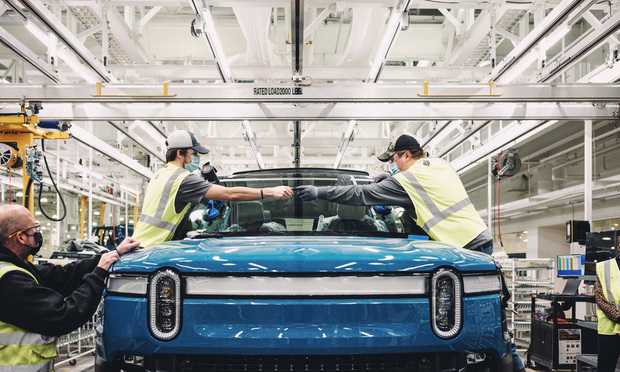 Many industries are using IoT devices to improve efficiencies and safety. (Rivian automotive assembly line photo is from the ALM Media archives)