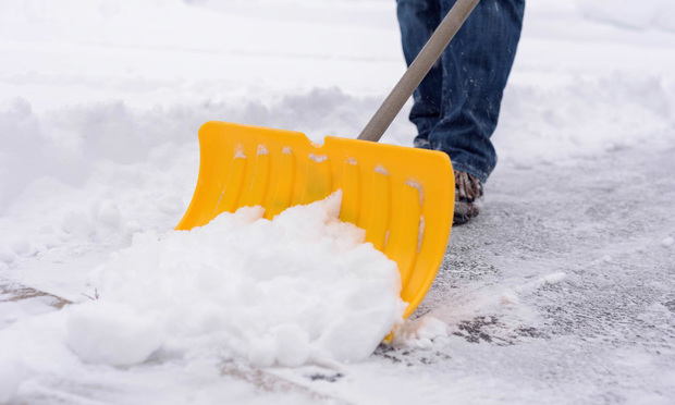 Put together a stash of nonperishable snacks, like granola bars and bottled water, blankets, an ice scraper, a show shovel and road salt to keep in your vehicle in case you get stuck on the road in winter weather. (Credit: Kristen Prahl/Shutterstock.com)