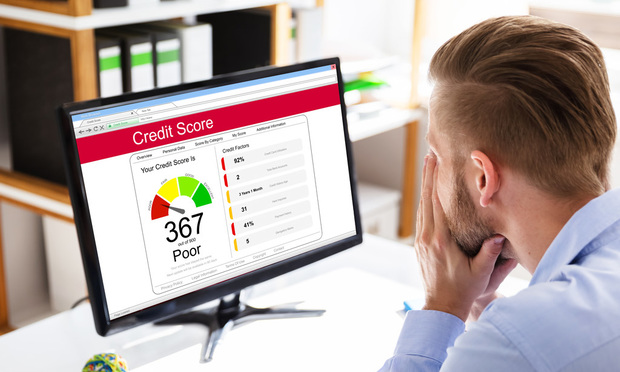 There are benefits to even minimally increasing your credit score. According to the report, drivers nationwide who improve their credit score just one tier could save an average of 17% a year. (Credit: Andrey Popov/Adobe Stock)