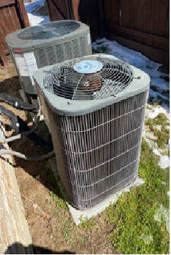Side-by-side outdoor air conditioning condensing units.